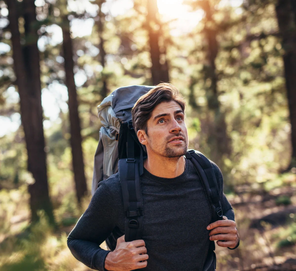 young hiker looking out into the distance with good vision