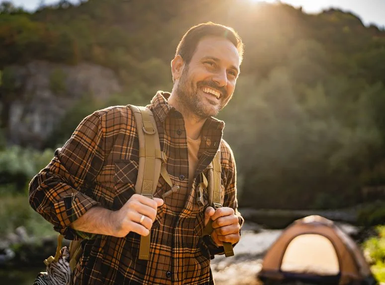 Happy man camping