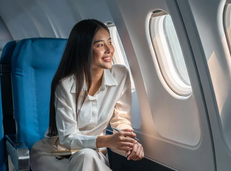 Happy woman on a flight