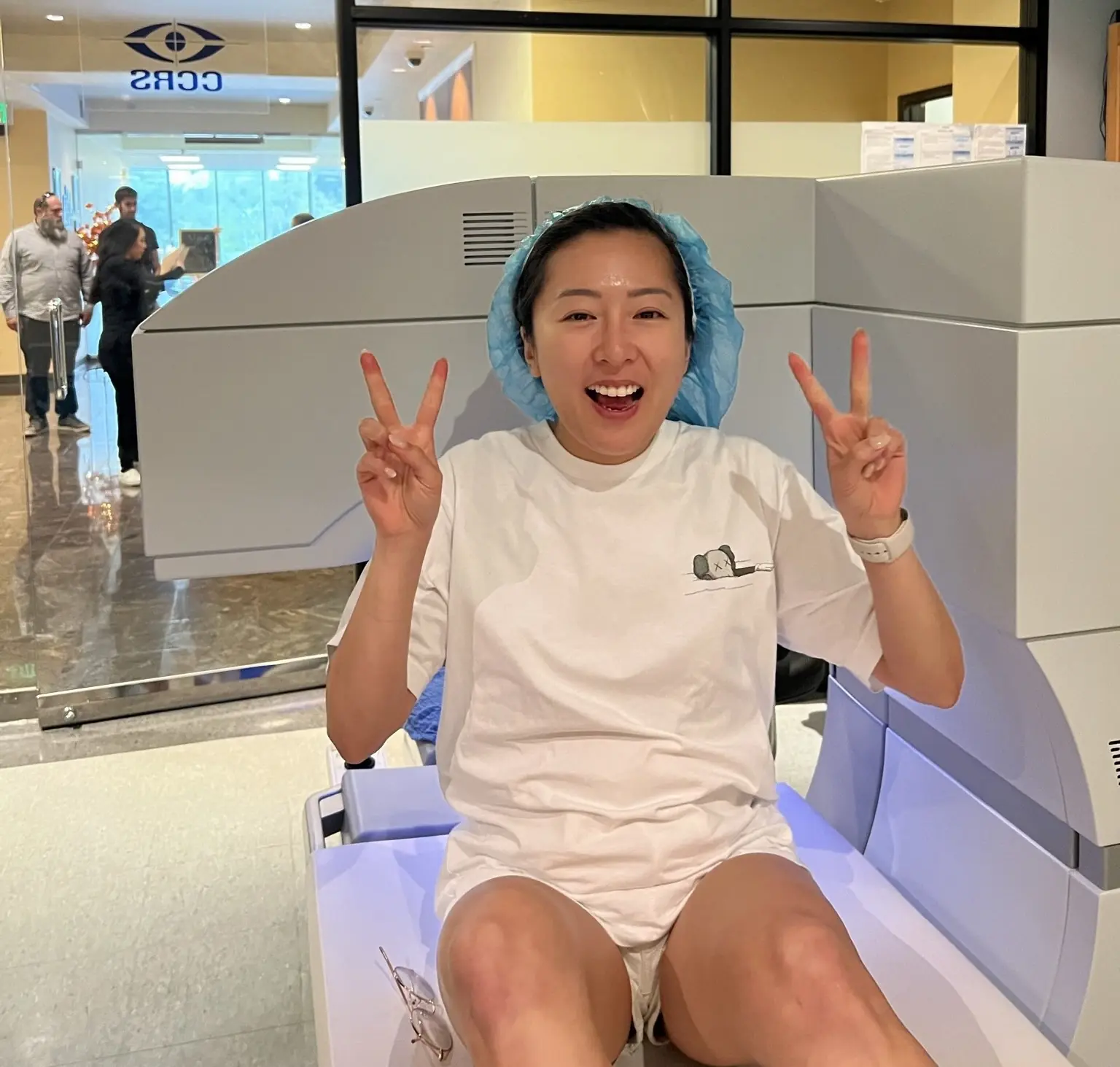 a happy lasik patient cheering at CCRS Clear Vision