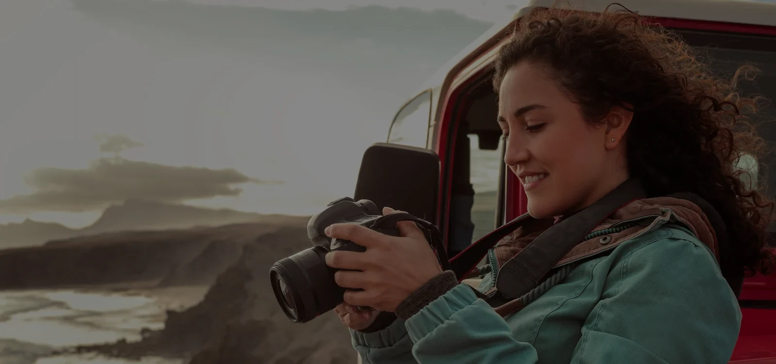 young healthy person looking at their camera after taking a picture